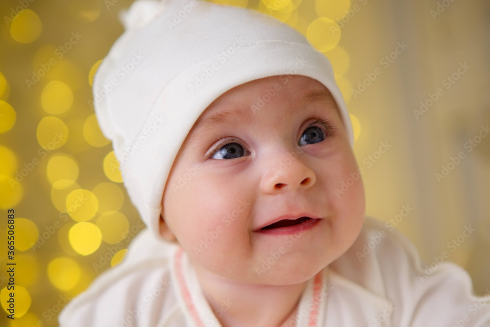 Little newborn baby girl lying in white clothes Little newborn baby girl lying in white clothes