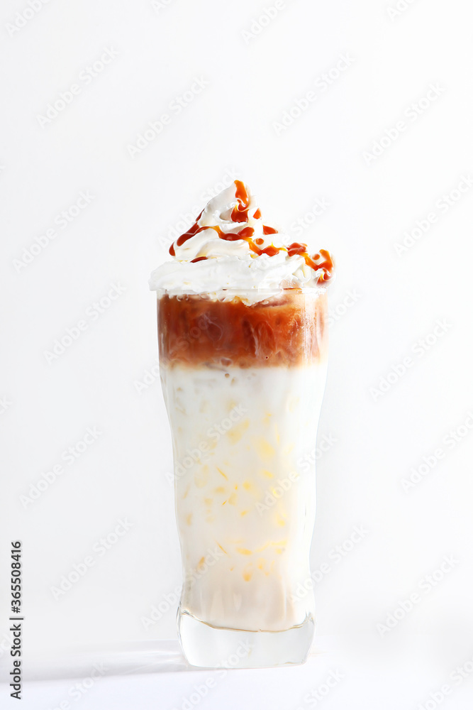 Milk and coffee soft drink. Photo on a light background. Vertical photo.Copy of the space. Milk and coffee soft drink. Photo on a light background. Vertical photo.Copy of the space.