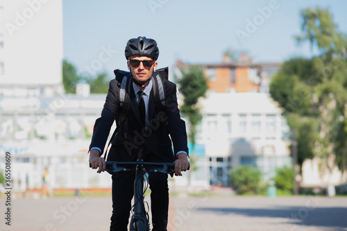 Obraz na plátne Portrait of a male commuter riding a bicycle