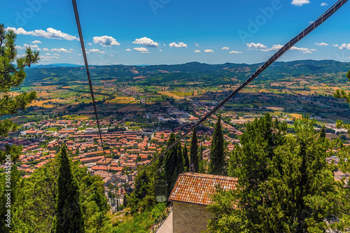 A view from the top of the Colle Eletto cable car over the city of Gubbio, Italy in summer photo