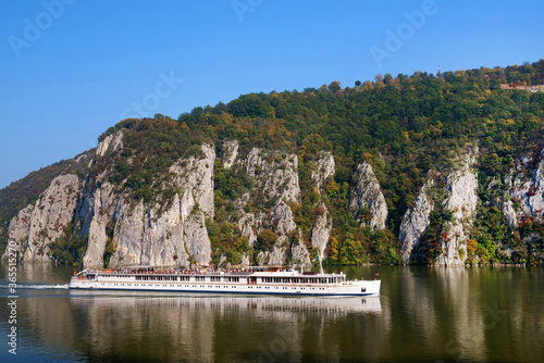 The Danube river flowing through the mountains, Romania, Europe photo