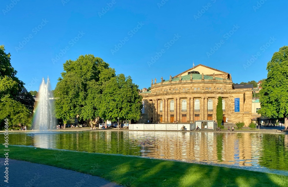 The Stuttgart State Theatre Opera building and fountain in Eckensee lake, Germany.