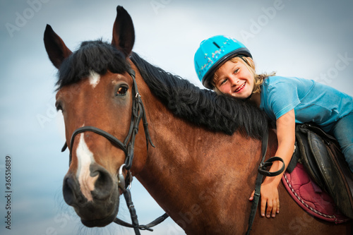 happy little girl hug horse, horse theraphy