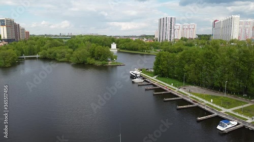 Live complex ''Mayak''. There are boats near houses and river with forest. Good place near Moscow in Khimki.