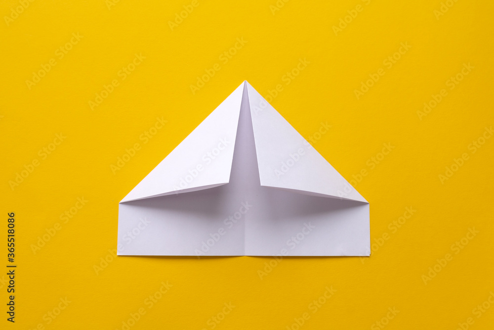 Fototapeta premium assembly procedure for a white paper ship. Origami.