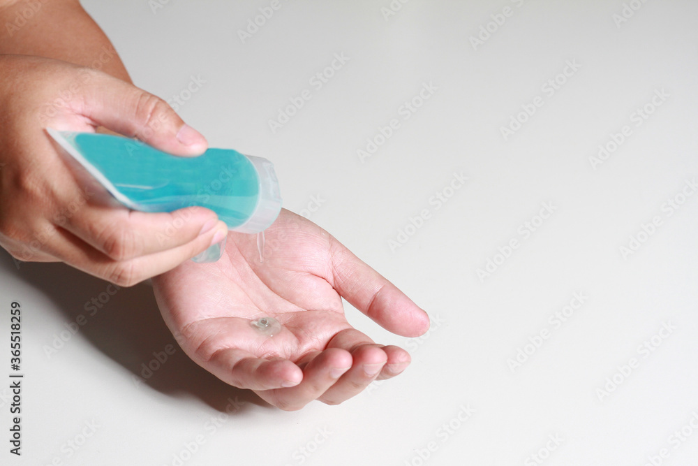 Hand sanitizer alcohol gel rub clean hands hygiene prevention of coronavirus virus outbreak. Man using bottle of antibacterial sanitiser soap. Hand sanitizer alcohol gel rub clean hands hygiene prevention of coronavirus virus outbreak. Man using bottle of antibacterial sanitiser soap.