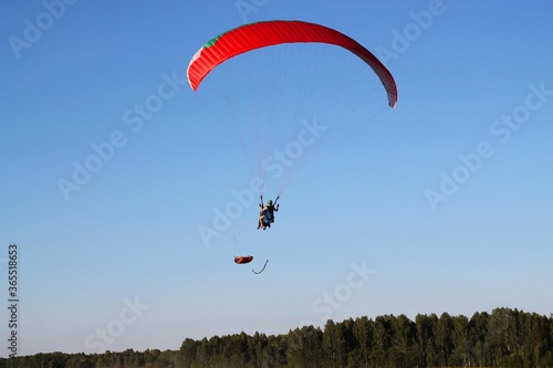 paragliding in the blue sky