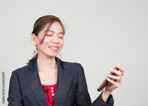 Portrait of happy Asian businesswoman against white background