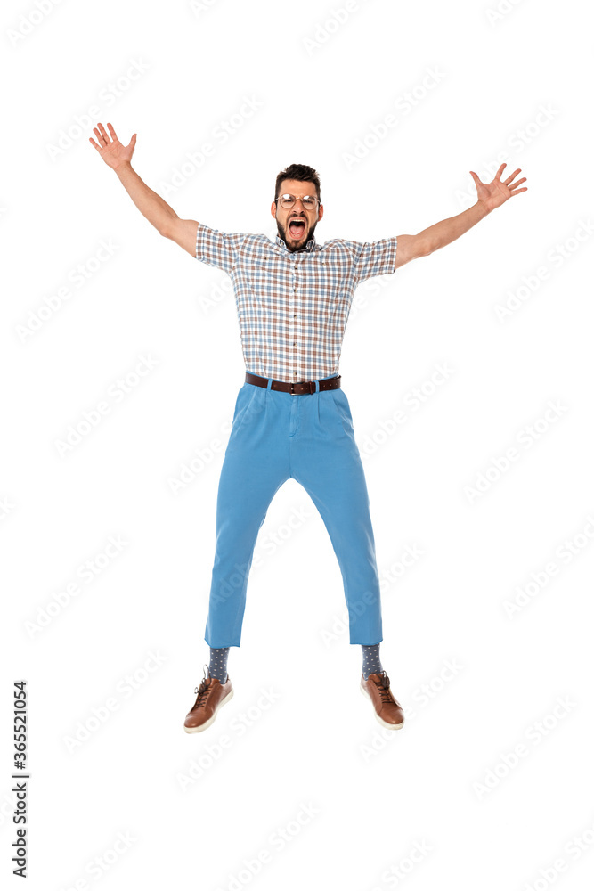Excited nerd with raised hands looking at camera isolated on white Excited nerd with raised hands looking at camera isolated on white