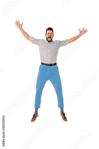 Excited nerd with raised hands looking at camera isolated on white