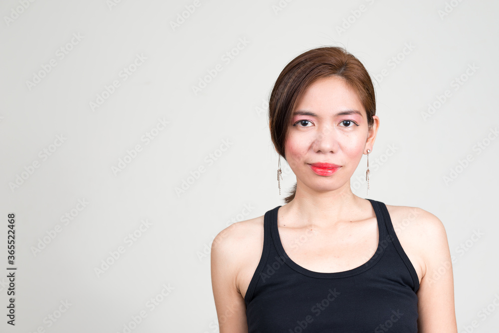 Portrait of Asian woman against white background Portrait of Asian woman against white background