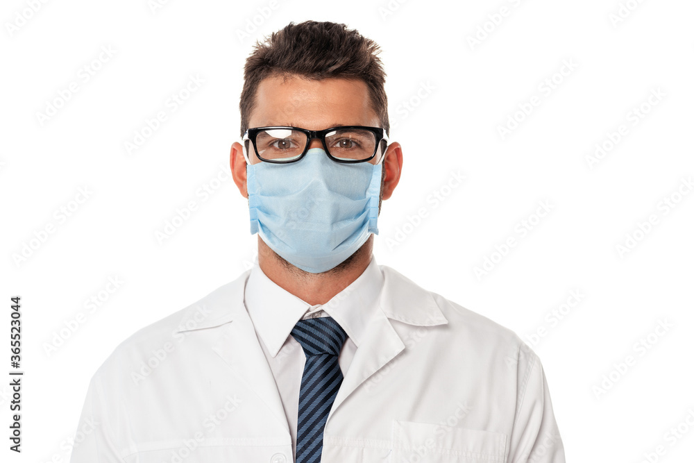 Doctor in medical mask and eyeglasses looking at camera isolated on white Doctor in medical mask and eyeglasses looking at camera isolated on white