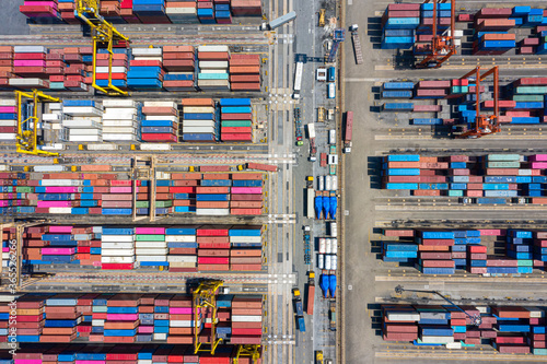 Container , container ship in export and import business and logistics. Shipping cargo to harbor by crane. Water transport International. Aerial view and top view. © MAGNIFIER