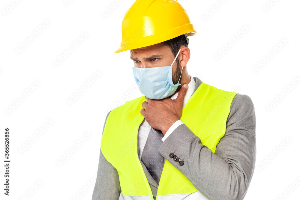 Sick engineer in hardhat and medical mask touching neck isolated on white Sick engineer in hardhat and medical mask touching neck isolated on white