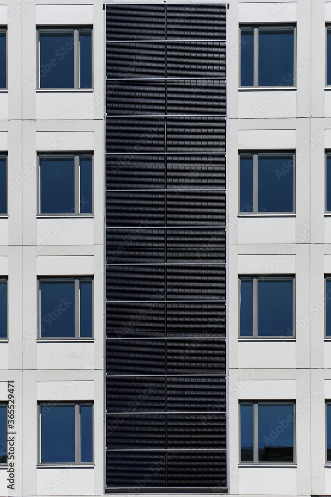 Solar panels on the facade of a residential building.