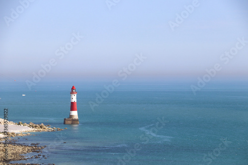 lighthouse in the oceans and blue sky