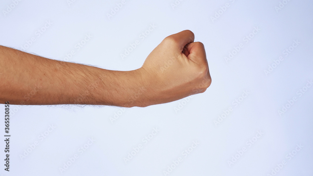Male fist. gesture threatens and aggression on isolated white background Male fist. gesture threatens and aggression on isolated white background