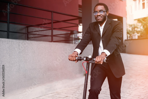 A man rides an electric scooter. avoid public transport becuase photo