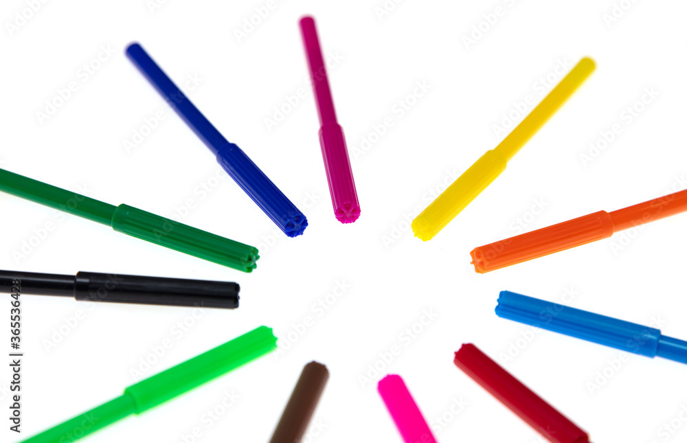 Colored felt-tip pens on a white background. Colored felt-tip pens on a white background.