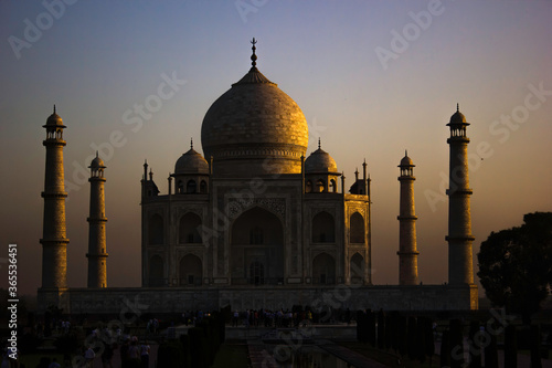 Agra, India - April 10,2014: Close up of Tajmahal, one of the seven wonder partially lit under dramatic sunrise
