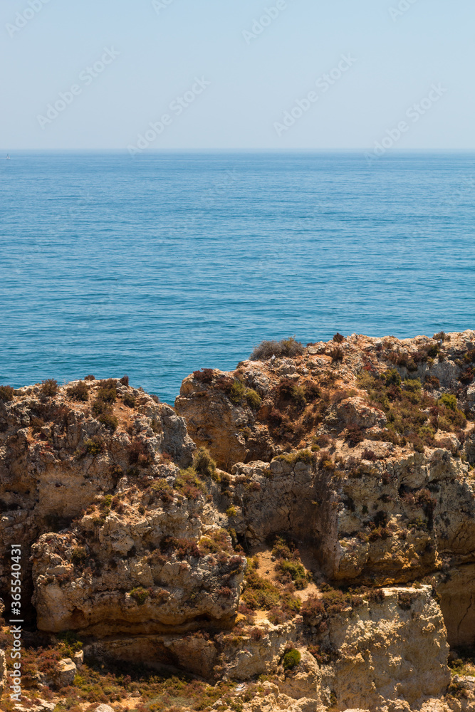 Algarve, Lisbon. Beautiful bay near Lagos town with high cliffs on the shore of the Atlantic Ocean. The Algarve is the southernmost region of continental Portugal. 