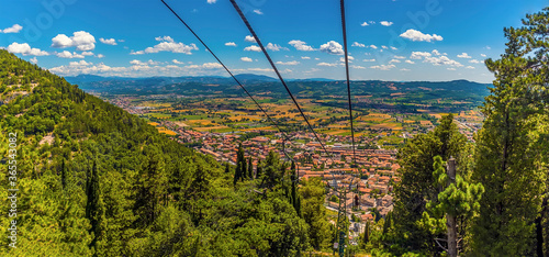 Bild auf Leinwand A panorama view down the Colle Eletto cable car from the top of Mount Ingino ove