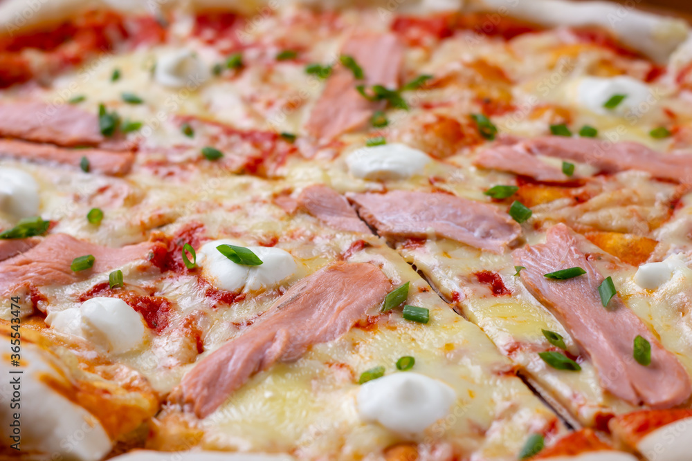 Close up of hot pizza with salmon and cheese Close up of hot pizza with salmon and cheese