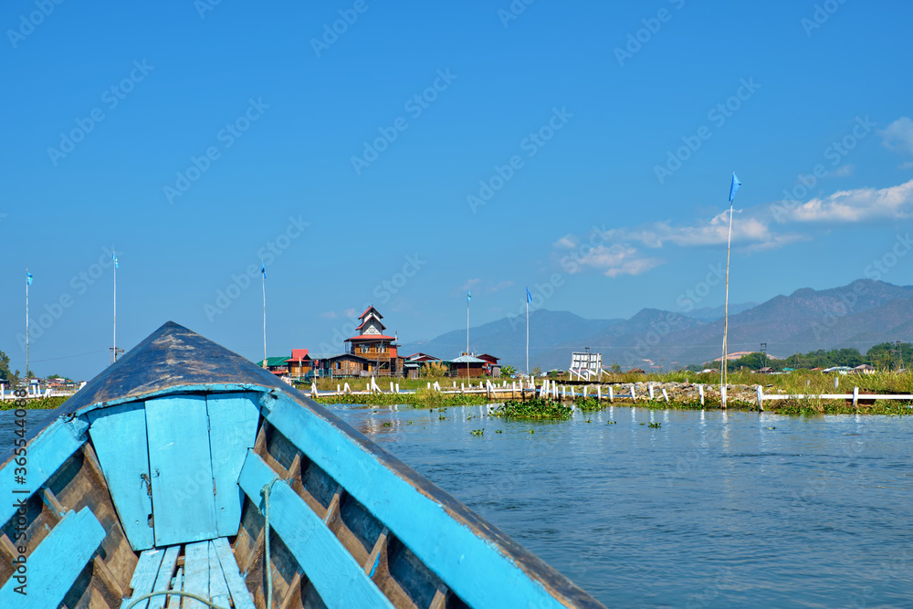 INLE, MYANMAR - JANUARY 27, Wooden floating houses on Inle Lake in Shan, Myanmar, view from boat