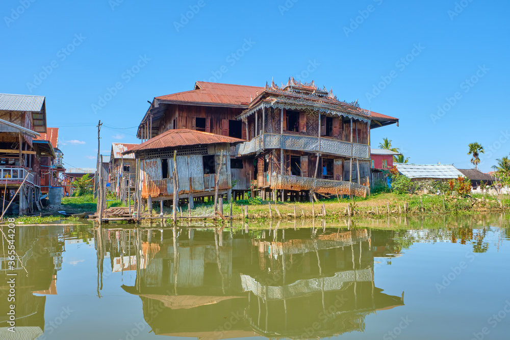 Wooden floating houses on Inle Lake in Shan, Myanmar, view from boat