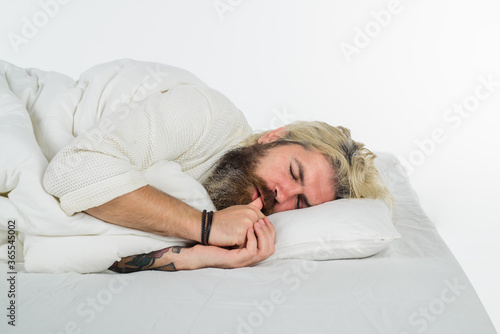 Sleep. Bearded man sleep in bed. Bearded man in bed. Morning and wake up. Man sleeping in bed at home. Man sleeping on white bed.