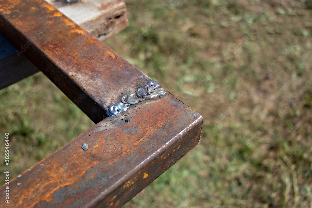 Rusty metal pipe with welded seam with copy space. Seam from welding. Concept of welding Rusty metal pipe with welded seam with copy space. Seam from welding. Concept of welding