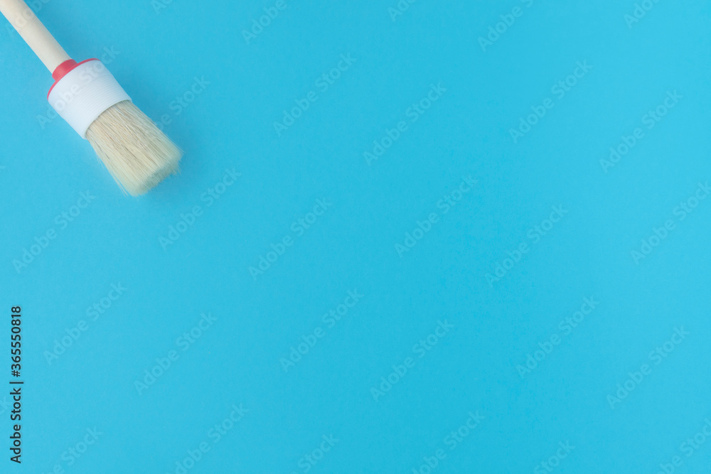 brush for painting on a blue background. Repair brush for painting on a blue background. Repair