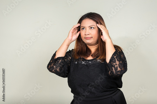 Portrait of young beautiful overweight Asian businesswoman