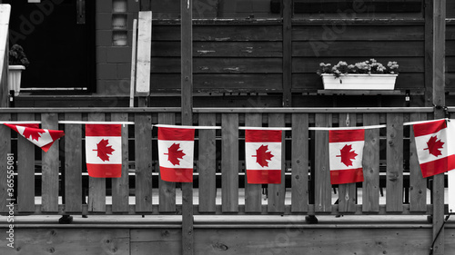 Fotografija Red Canada Flags at the Royal Canadian Legion in Canmore Selective Color Wallpap