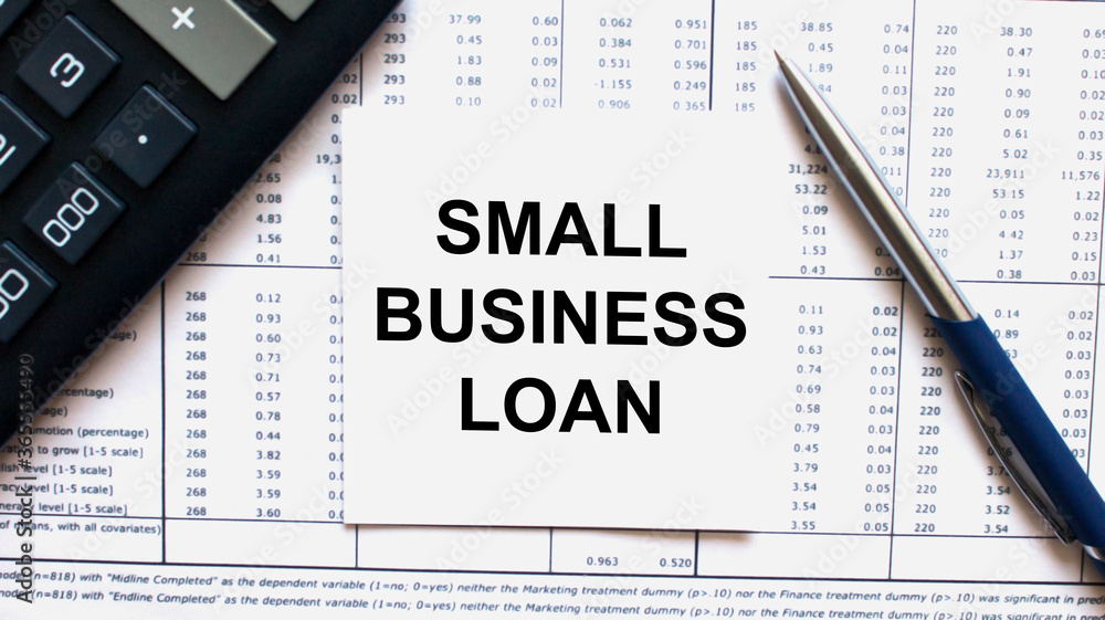 Work smarter text Small Business Loan on white sheet with pen, calculator and tables Work smarter text Small Business Loan on white sheet with pen, calculator and tables