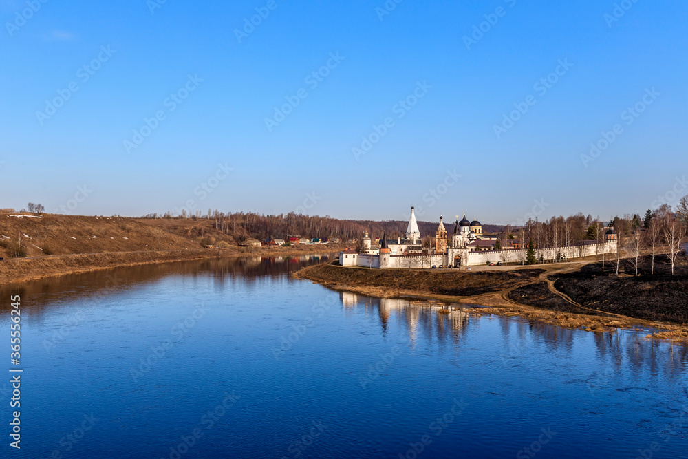 The Volga River flows past the Staritsky Holy Assumption Monastery. Town Staritsa. Russia.