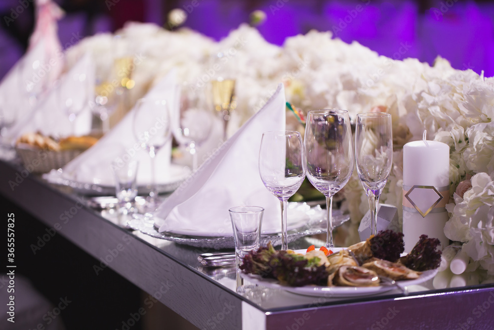 A Grand restaurant and a ballroom in a luxury hotel. The interior design is executed in classical style. A Grand restaurant and a ballroom in a luxury hotel. The interior design is executed in classical style.