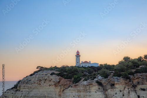 lighthouse at the Algarve coast in Carvoeiro, Portugal