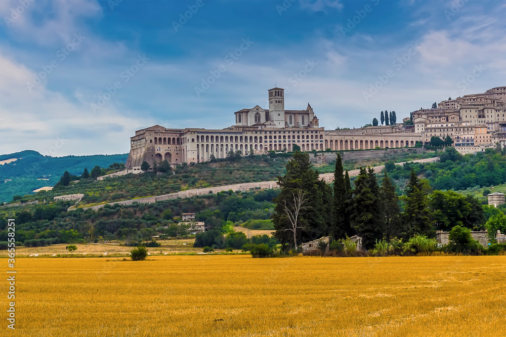 A view towards the town of Assisi, Umbria, Italy and the Basilica of Saint Francis in the summertime