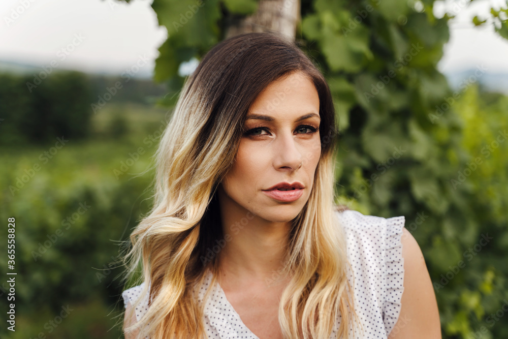 Front view on caucasian woman standing outdoor - Close up portrait of beautiful adult female in summer evening or day in nature - Real people contemplation solitude concept Front view on caucasian woman standing outdoor - Close up portrait of beautiful adult female in summer evening or day in nature - Real people contemplation solitude concept