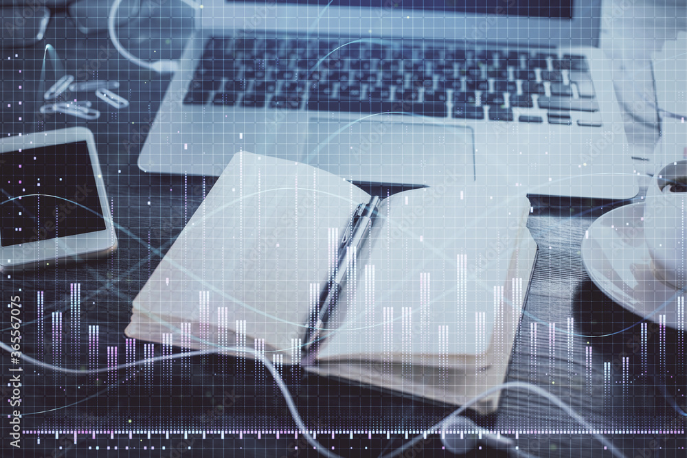 Multi exposure of financial graph drawings and desk with open notebook background. Concept of forex