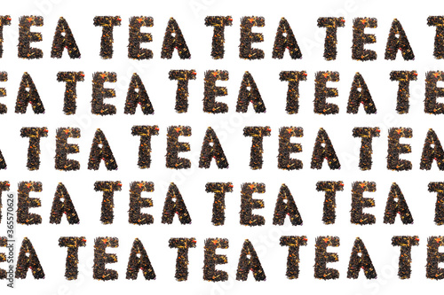 colorful pattern of words from tea on a black background top view
