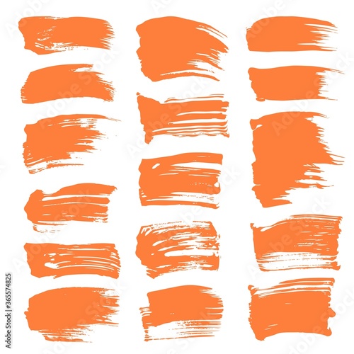 Orange textured dry paint short strokes set on white backckground photo