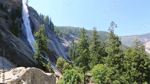 side view of Nevada Fall waterfall from Mist Trail in Yosemite National Park. Summer travel holidays in California, United States. photo