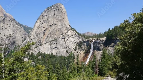 Panorama of Liberty Cap and Nevada Fall waterfall on Merced River from John Muir trail in Yosemite National Park. Summer travel holidays in California, United States. photo