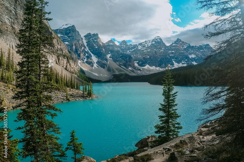 Fototapeta Naklejka Na Ścianę i Meble -  Breathtaking view of turquoise water of Moraine Lake, tourist popular attraction/destination in Canadian Rockies, Banff National Park, Alberta, Canada