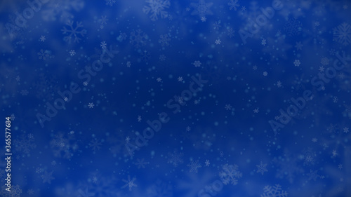 Christmas background of snowflakes of different shapes, sizes, blur and transparency in blue colors