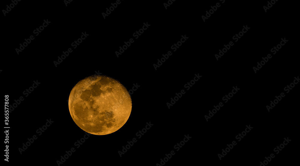 Fototapeta premium Waning gibbons moon in night sky