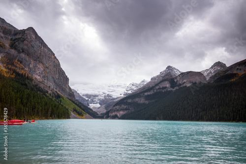 Lake Louise with canoes and cold dark clouds © oloololo