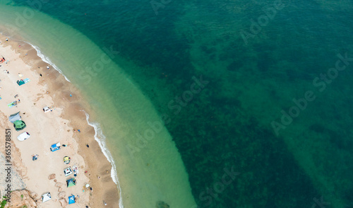 Many tourists are on the beach in summer, taking photos with Dalian City, Liaoning Province, China photo